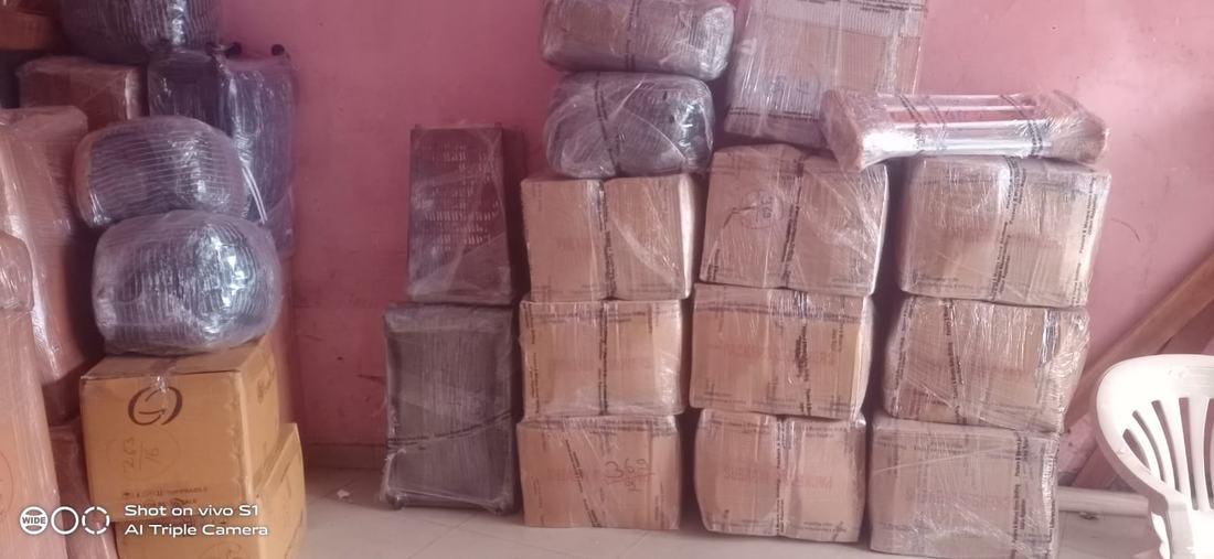 Rows of shrink-wrapped cartons stacked and secured